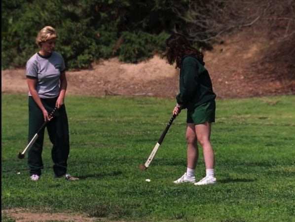 girls play hockey