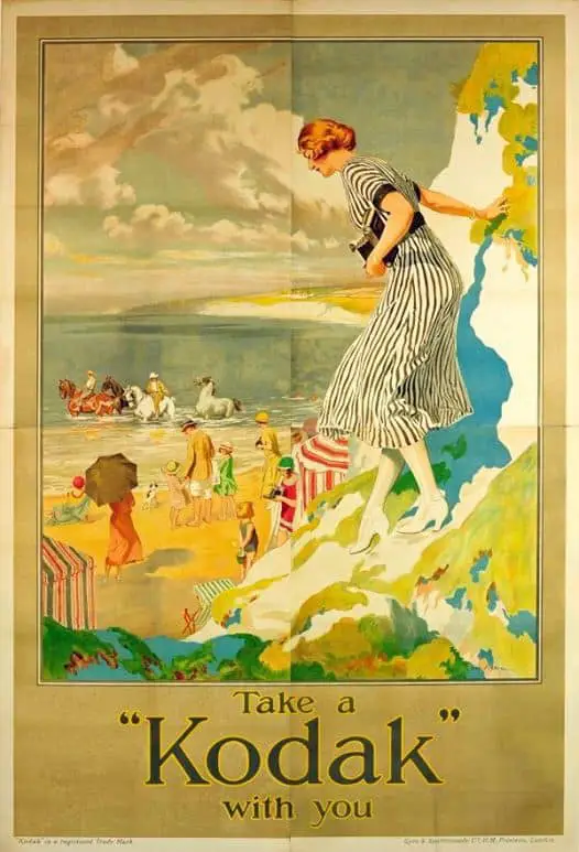 1930s, Take a Kodak with you - featuring the iconic Kodak Girl by the British seaside.  Artist- Fred Pegram (1870-1937)