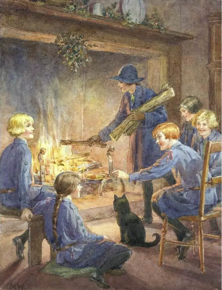 Girl guides sit around a fire. One girl puts logs on the fire. A black cat sits nearest.